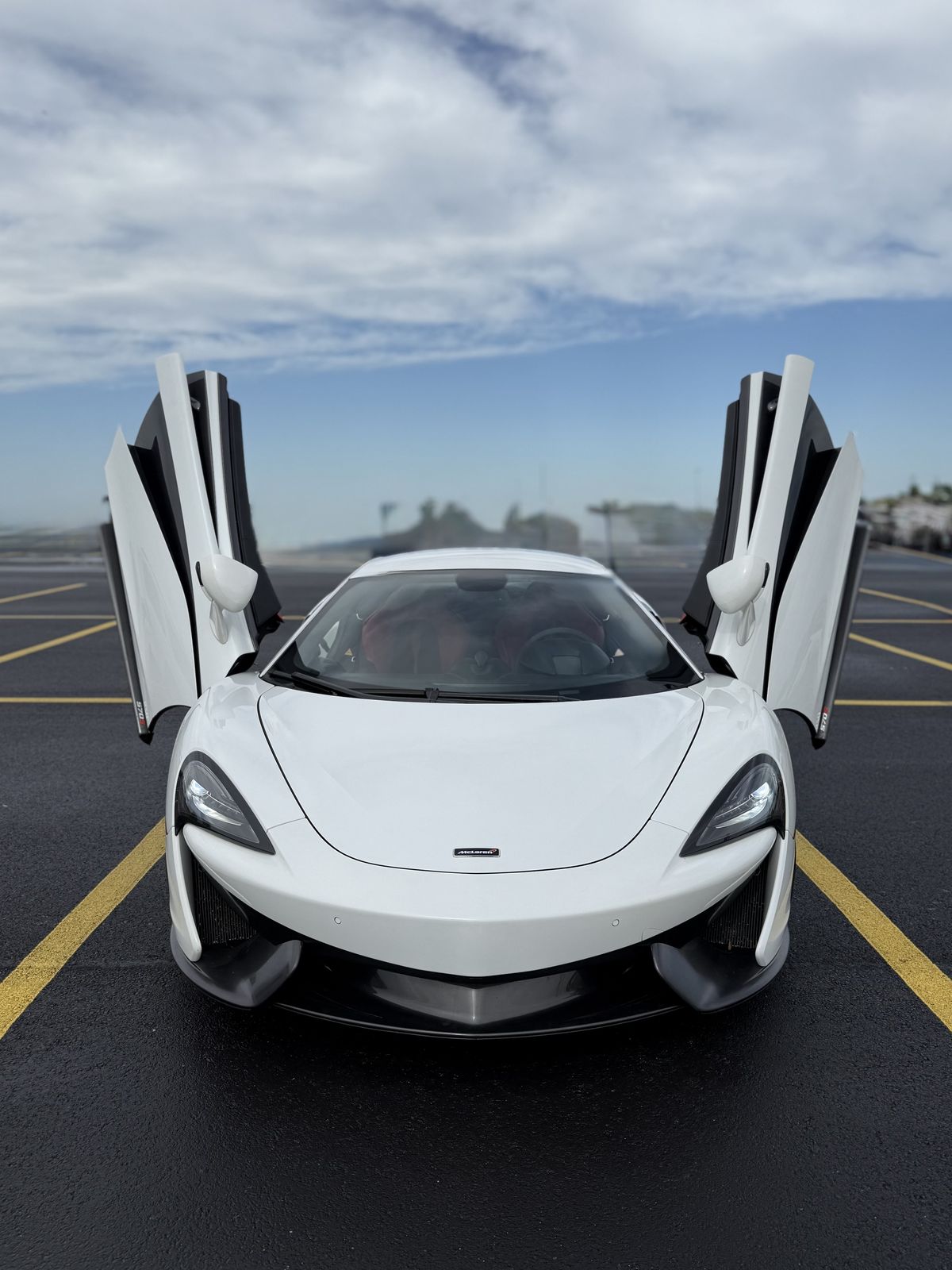 White McLaren 570S with doors open